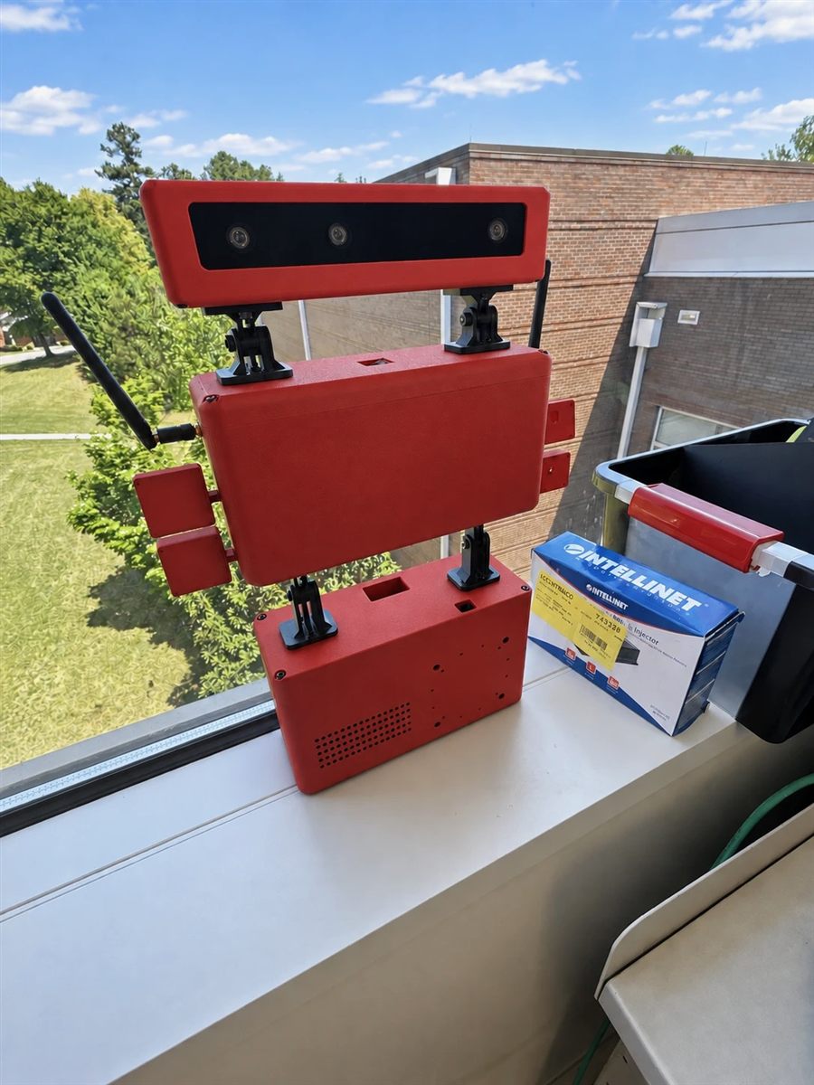 Sensing Unit V2 with its red three-tier enclosure and camera module